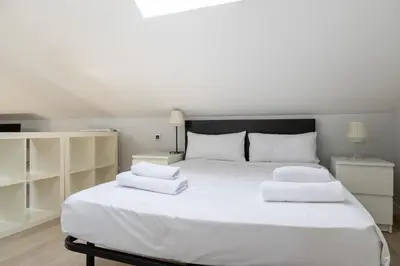 Cama o camas de una habitación en Encanto y Comfort en Habitaciones de Pilar de Zaragoza