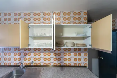 Una cocina o zona de cocina en Central Madrid Apartment with Garden Views, Sunny Private Terrace, Fast WiFi & Metro Access