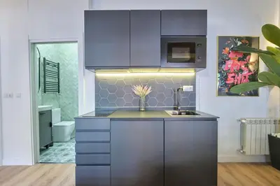 Una cocina o zona de cocina en ºRS CityCentre DownTown WiFi AC SmartTVº