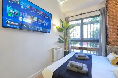 Cama o camas de una habitación en ººRS CityCentre DownTown WiFi AC SmartTVºº