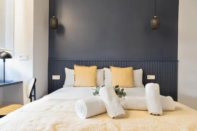 Cama o camas de una habitación en Calma Rooms by Charming
