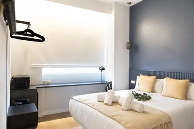 Cama o camas de una habitación en Calma Rooms by Charming