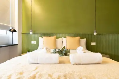 Cama o camas de una habitación en Calma Rooms by Charming