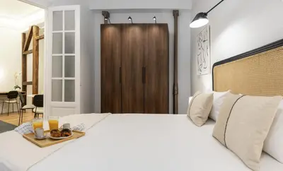 Cama o camas de una habitación en Justicia Centric