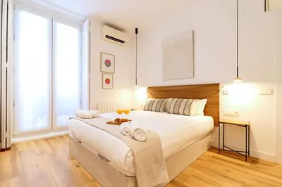 Cama o camas de una habitación en Justicia Centric