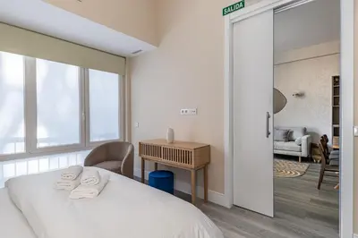 Cama o camas de una habitación en Waou Glam Plaza España