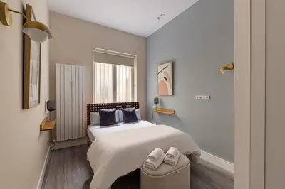 Cama o camas de una habitación en Waou Glam Plaza España