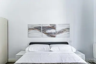 Cama o camas de una habitación en VR Estudios Apartments