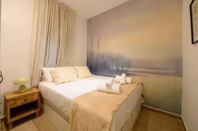 Cama o camas de una habitación en For You Rentals Encantador apartamento TEMPORAL de dos dormitorios PAL100