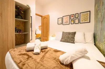 Cama o camas de una habitación en For You Rentals Encantador apartamento TEMPORAL de dos dormitorios PAL100