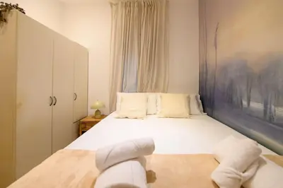 Cama o camas de una habitación en For You Rentals Encantador apartamento TEMPORAL de dos dormitorios PAL100