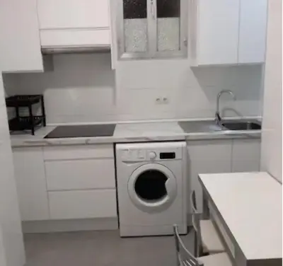 Una cocina o zona de cocina en Plaza España RIO