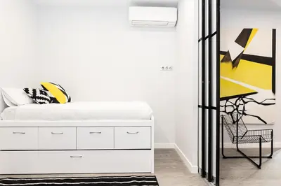 Cama o camas de una habitación en Waou Gran Via IV - Alquiler Corta Duración