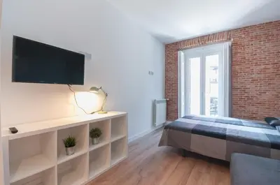 Cama o camas de una habitación en ººRA New Atocha City Centre WiFi AC SmartTVºº
