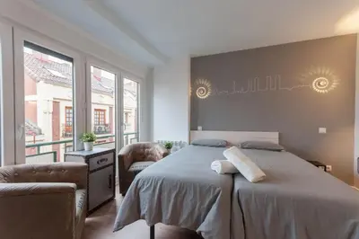 Cama o camas de una habitación en ºººDL New Atocha City Centre WiFi AC SmartTVººº