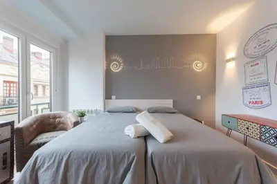 Cama o camas de una habitación en ºººDL New Atocha City Centre WiFi AC SmartTVººº