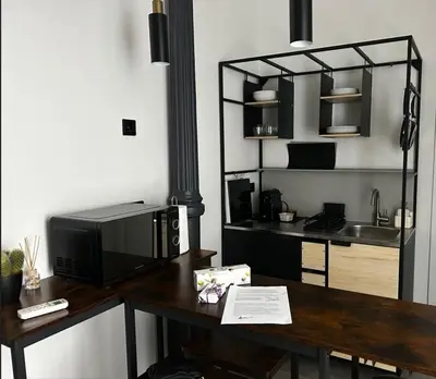 Una cocina o zona de cocina en Soho Loft estilo industrial céntrico