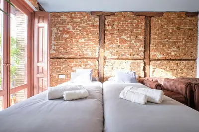 Cama o camas de una habitación en ºººPY Historical CityCentre WiFi AC SmartTVººº