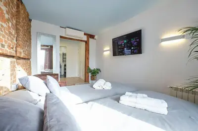 Cama o camas de una habitación en ºººPY Historical CityCentre WiFi AC SmartTVººº