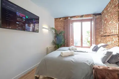 Cama o camas de una habitación en ºººPY Historical CityCentre WiFi AC SmartTVººº