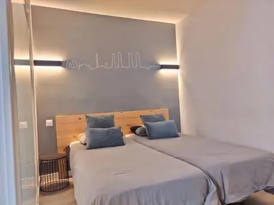 Cama o camas de una habitación en ºEM Historical CityCentre WiFi AC SmartTVº