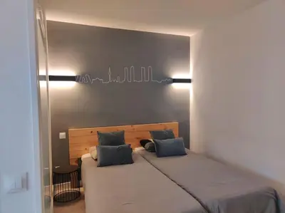 Cama o camas de una habitación en ºEM Historical CityCentre WiFi AC SmartTVº
