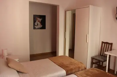 Cama o camas de una habitación en Casa de Huéspedes Galaica