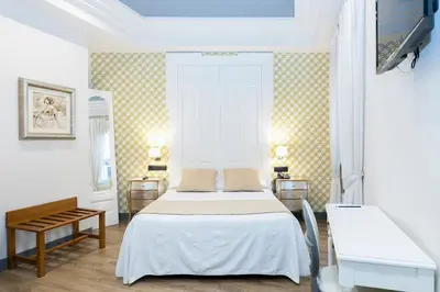 Cama o camas de una habitación en Hostal Oriente