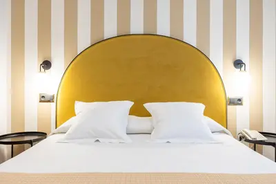 Cama o camas de una habitación en Hostal Oriente