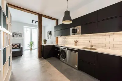 Una cocina o zona de cocina en Exclusive designer loft in the centre for 6 people - Duque