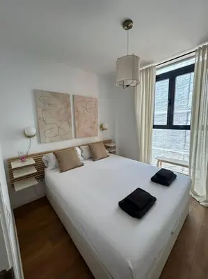 Cama o camas de una habitación en MyHouseSpain - Piso con terraza en Madrid