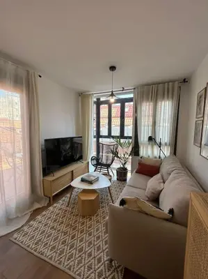 Una televisión o centro de entretenimiento en MyHouseSpain - Piso con terraza en Madrid