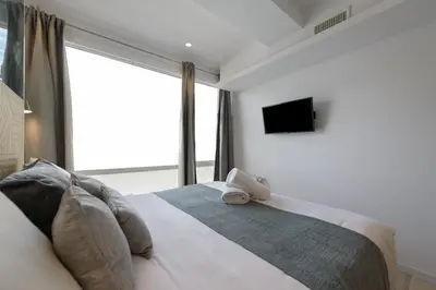 Cama o camas de una habitación en Deluxe SOL, by MONARO