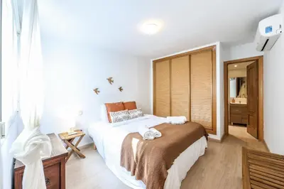 Cama o camas de una habitación en ARCO Gran Via Boutique Apartments