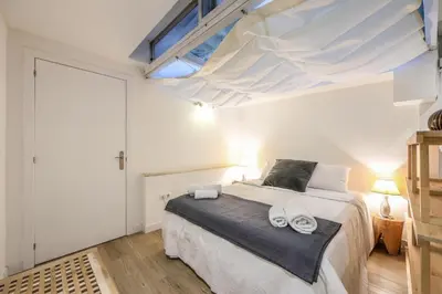 Cama o camas de una habitación en ARCO Gran Via Boutique Apartments