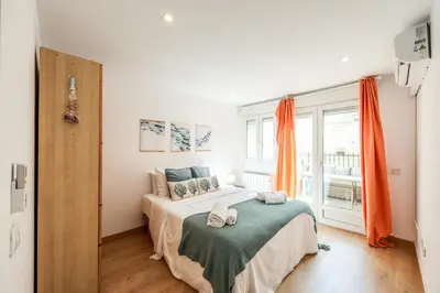Cama o camas de una habitación en GranVia Garden Boutique Apartments