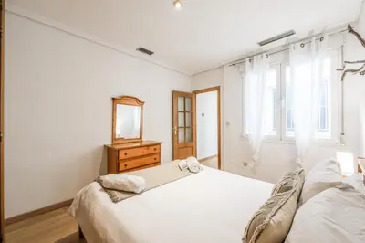 Cama o camas de una habitación en GranVia Garden Boutique Apartments