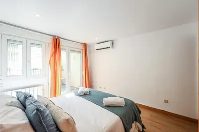 Cama o camas de una habitación en GranVia Garden Boutique Apartments