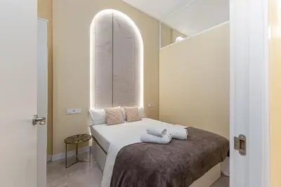 Cama o camas de una habitación en Queen's Chamberí Boutique I - Alojamiento Corta Estancia