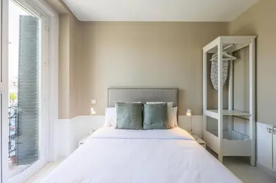 Cama o camas de una habitación en Apartamentos Embajadores XX