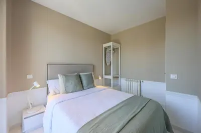 Cama o camas de una habitación en Apartamentos Embajadores XX