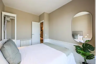 Cama o camas de una habitación en Apartamentos Embajadores XX
