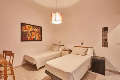 Cama o camas de una habitación en Hostal Barrera