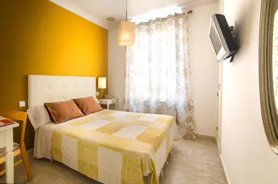 Cama o camas de una habitación en Hostal Barrera