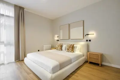 Cama o camas de una habitación en Dobo Madrid Justicia
