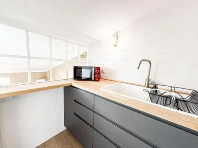 Una cocina o zona de cocina en Charming penthouse in Madrid-Centro - Oso