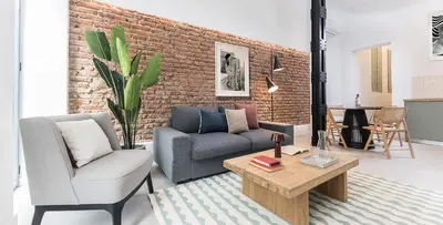 Zona de estar de Homeclub Moderno Bajo Andrés Mellado I