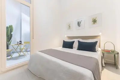 Cama o camas de una habitación en Homeclub Moderno Bajo Andrés Mellado I