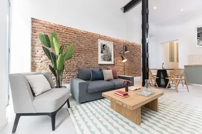 Zona de estar de Homeclub Moderno Bajo Andrés Mellado I