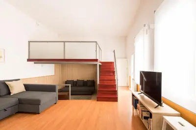 Una televisión o centro de entretenimiento en Modern Loft in Madrid Río - Style and Comfort - Manzanares
